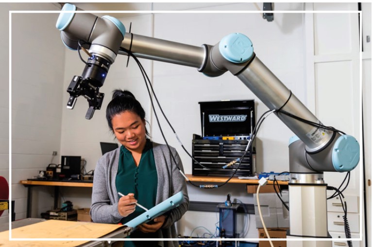 woman working with robot arm