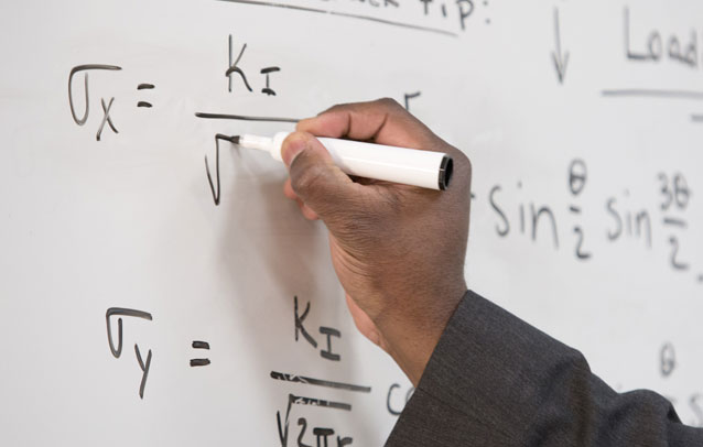 writing equation on whiteboard