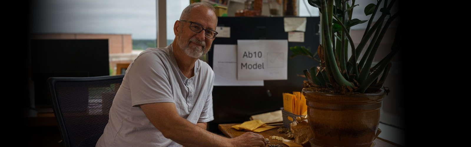 Kelly Dawe, Distinguished Research Professor in UGA’s Franklin College of Arts and Sciences, examines kernels in his office. His groundbreaking work in maize genetics has helped reshape how researchers understand—and improve—this vital crop. (Photo by Brandon Ward)